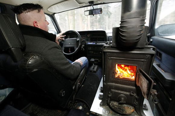 Zany Swiss man installs woodburning stove in car